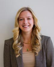 Photo of Alexis Redwine, smiling at the camera