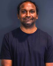 Photo of Raju Gorla, smiling at the camera