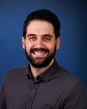 Photo of Aaron Teator, smiling at the camera